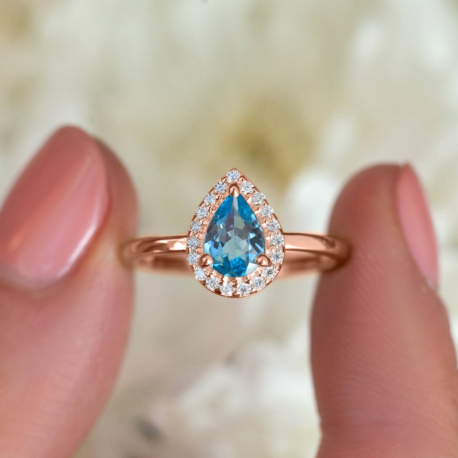 Tina Pear Swiss Blue Topaz Ring with Halo Moissanites