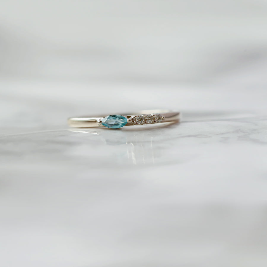 Tina Swiss Blue Topaz Ring With Side Moissanite