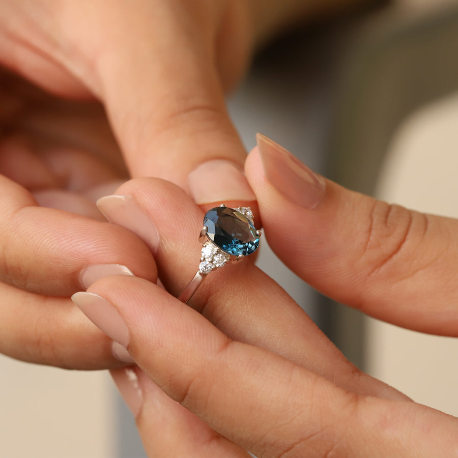 Olivia London Blue Topaz Ring with side Moissanite