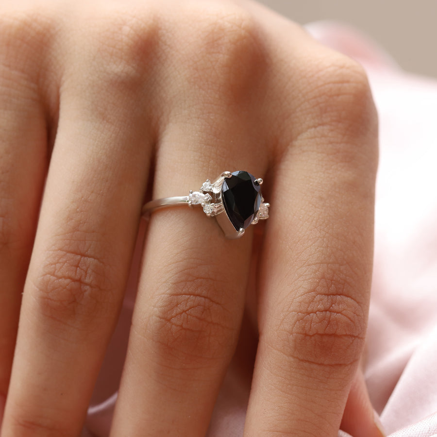 Aretha Pear Black Spinel Ring with Round Moissanite