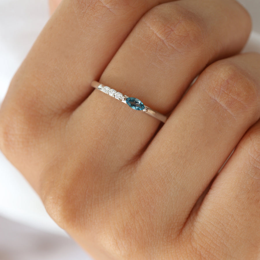 Tina London Blue Topaz Ring With Side Moissanite
