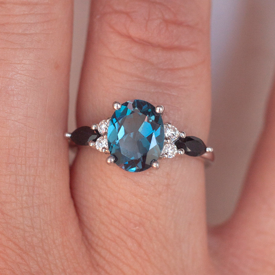 Lauryn Oval London Blue Topaz Ring with Moissanite and Black Spinel