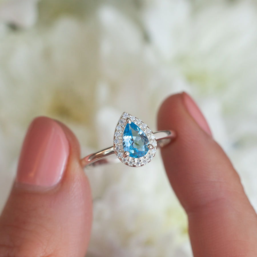 Tina Pear Swiss Blue Topaz Ring with Halo Moissanites